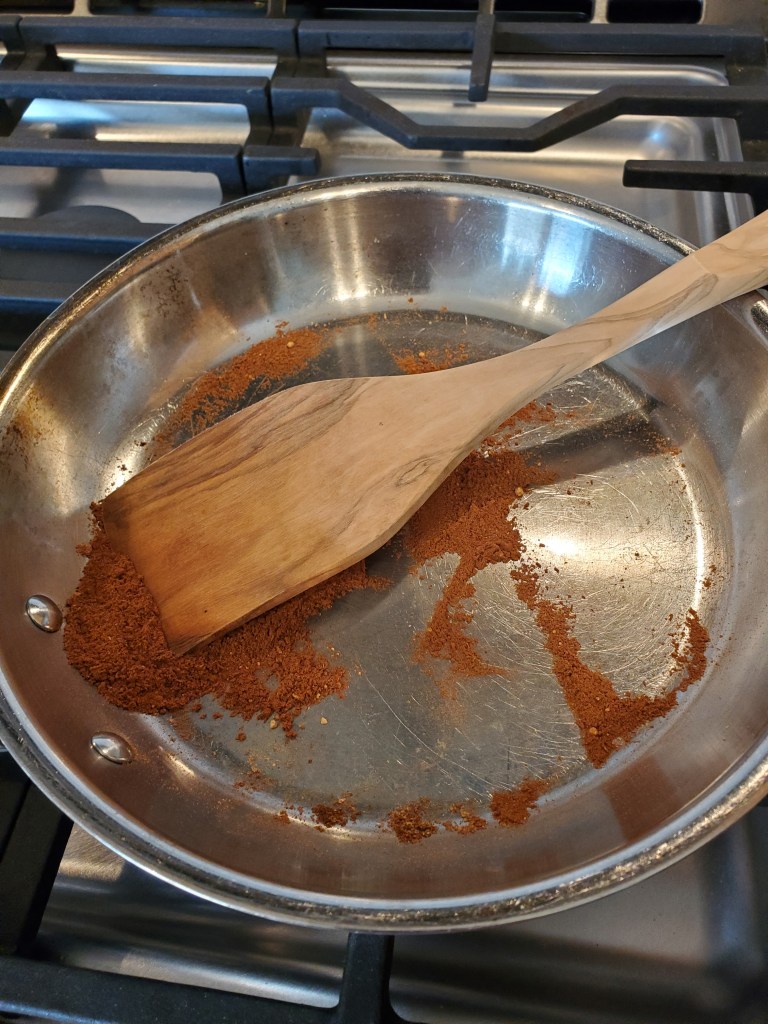 Pan toasting spices for pumpkin pie