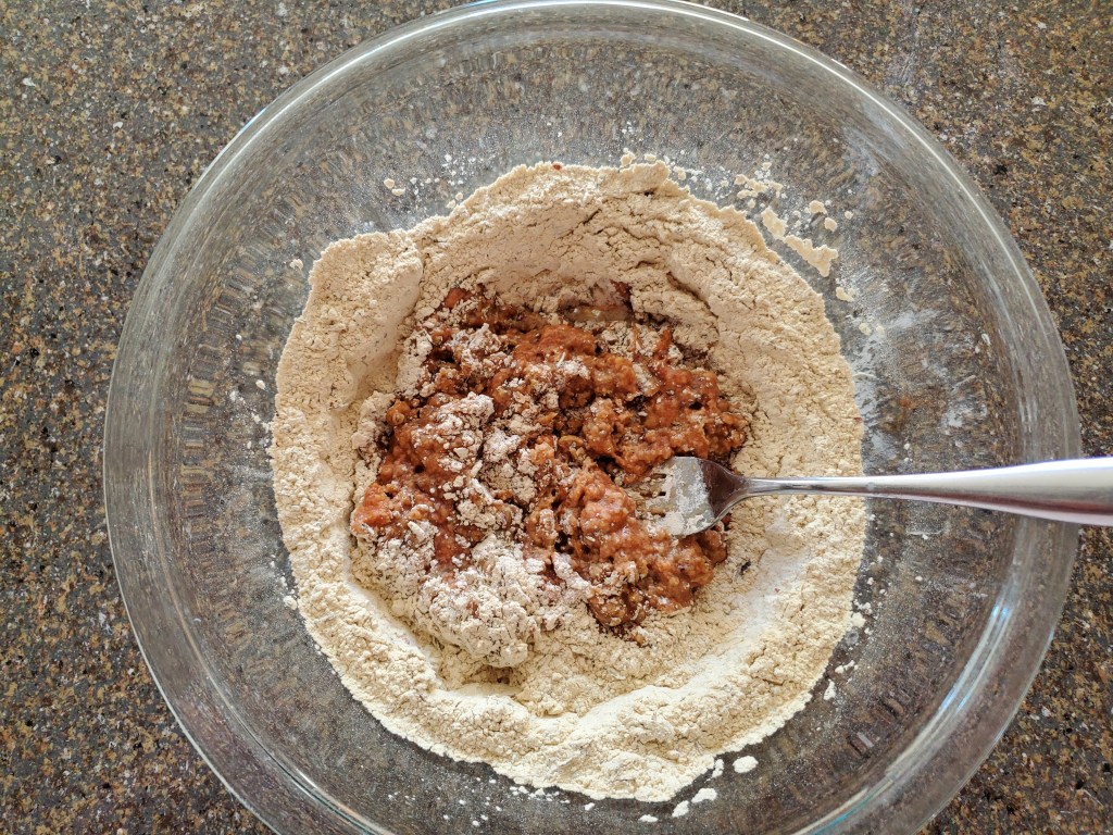 Mixing wet and dry ingredients together in bowl